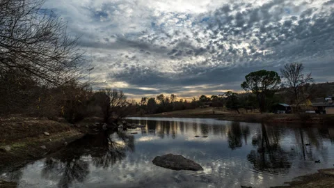 Winter Landscape Time Lapse with Duck Pond and Incoming Storm Stock Footage 284040162