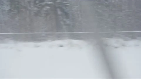 Winter landscape from the train window in the air. The movement of the train Stock Footage 195104089