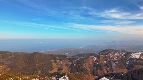 Winter Landscape Transition: From Snow-Capped Peaks to Blue Ocean Horizon Vídeo Stock 334892030