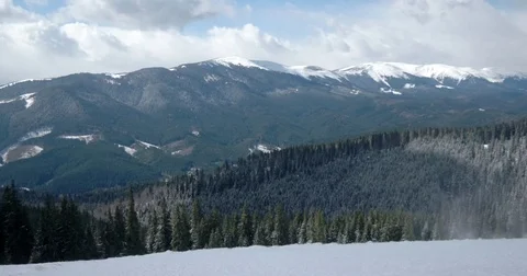 Winter Landscape With Trees, Snowy Mountains and Clouds, the Wind Blows Away Video stock 73827005