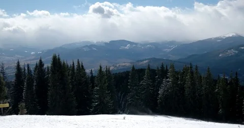 Winter Landscape With Trees, Snowy Mountains and Clouds, the Wind Blows Away Video stock 73827078