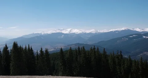 Winter Landscape With Trees, Snowy Mountains and Clouds, Panning View Vídeo Stock 74156713