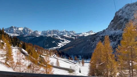 Winter landscape view from car driving snowy mountain road Dolomites Alps Italy Stock Footage 259129624