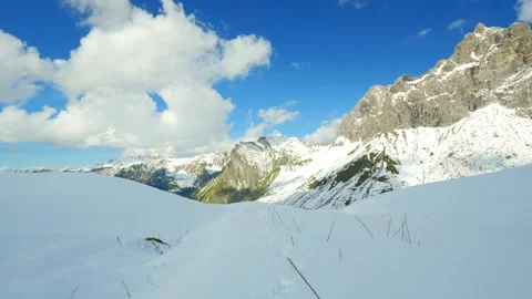 Winter Light Over Serene Snow Fields and Majestic Rocky Peaks in the Bavarian Stock Footage 308941359
