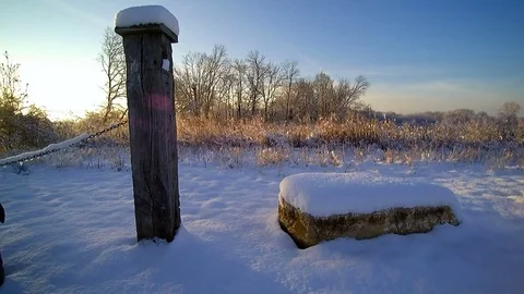 Winter low aerial flight over snowy prairie grass field. Stock Footage 70668474