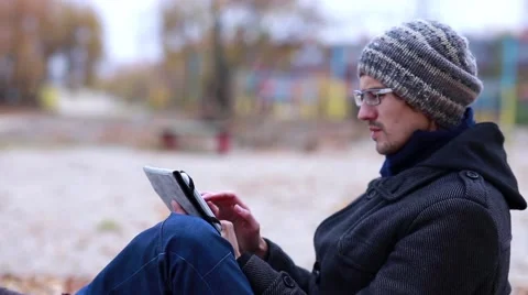 In Winter, a Man Uses Tablet Stock Footage 56639779