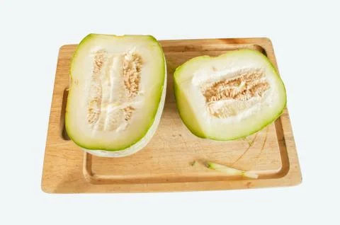 Winter melon, cut in half on chopping board. Stock Photos