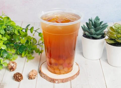 Winter Melon Rainbow Beads Ice Tea served on disposable glass isolated on w.. Stock Photos