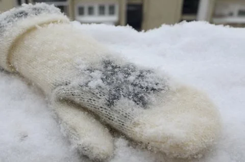 Winter Mitten on Snow Stock Photos