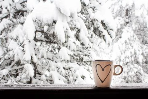 Winter morning on the mountain  with cup of coffee or tea with love. Stock Photos