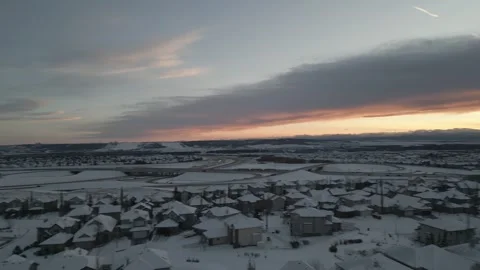 Winter Motion Pan City Skyline to Colorful Sunset with Dark Cloud Beam Stock Footage 321769467