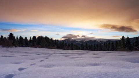 Winter mountain landscape covered with snow at dusk.Footprints of game in the Stock Footage 170692140