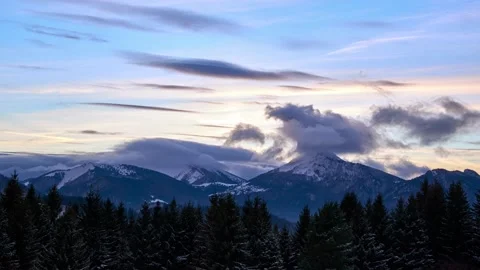 Winter mountain landscape at dusk, clouds over mountain alpine peaks Stock Footage 170692021