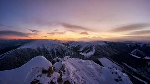 Winter mountain landscape timelapse during blue hour with soft wispy clouds Видео 336394840