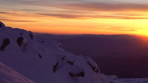 Winter Mountain Peak Orange Sunset Pan 4K Stock Footage 76517336