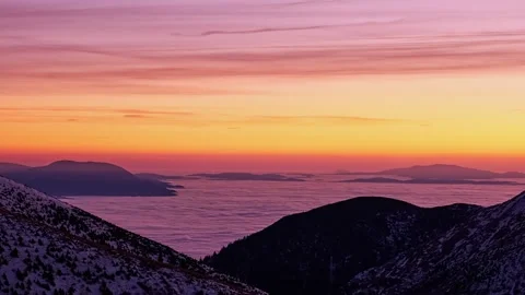 Winter Mountain Peaks above Cloud Inversion at Evening Dusk Stock Footage 326203121