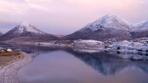 Winter mountain reflections and house on shore on very cold day. Drone, 4K Stock Footage 88876354