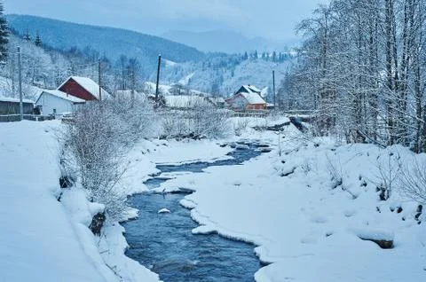 Winter mountain river after the snowfall Stock Photos
