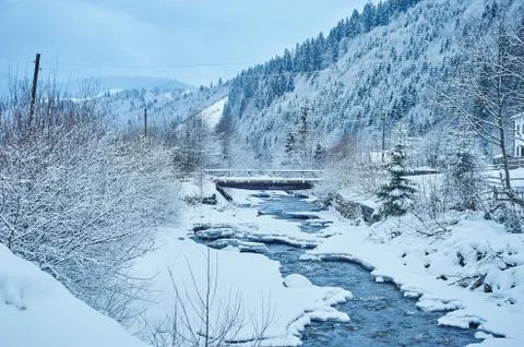 Winter mountain river after the snowfall Stock Photos