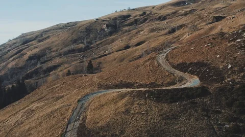 Winter mountain road fly over with drone, linear fly, 4k pro res Video stock 100473034