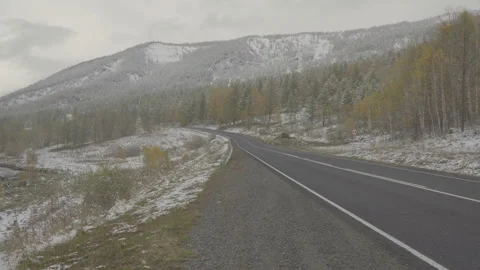 Winter mountain road snow fall. Mountain landscape snowfalling winter season Stock Footage 85545335