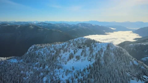 Winter Mountain Scene, Cloud filled Valley, Drone Stock Footage 169553397