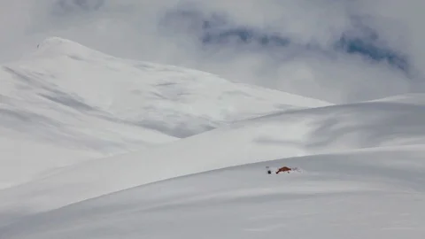 Winter Mountain. Shadows on the snowy slope. Tourist Tent Stockbeeldmateriaal 87978055