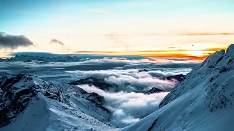 Winter mountain sunset with flowing clouds in cinematic motion clip. Stock Footage 341071960