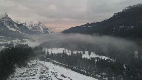 Winter Mountain valley in the clouds - drone shot Video stock 230157076