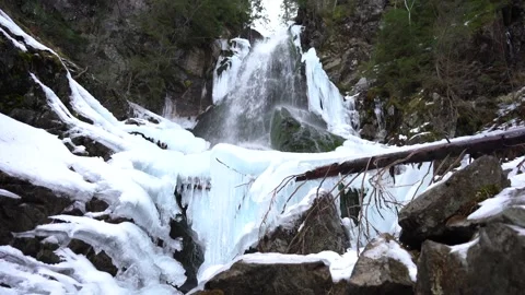 Winter mountain waterfall snow scene Stock Footage 146141612