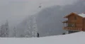 Winter Mountain Wooden Cabin Cable Car Passing Establishing Shot Skiers Resort 4k or 4k+ Resolution