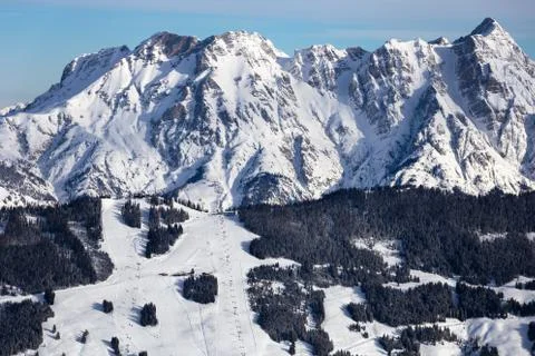 Winter mountains background with ski slopes and ski lifts. Skiing resort. Ext Stock Photos