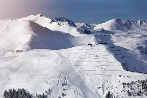 Winter mountains background with ski slopes and ski lifts. Skiing resort. Ext Stock Photos