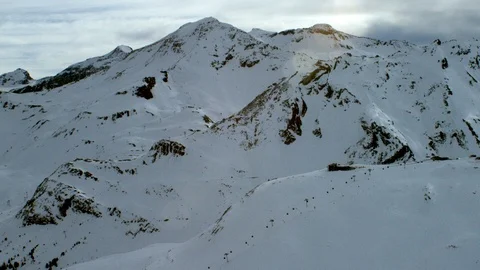 Winter mountains covered in snow with cloudy sky panorama during day time Stock Footage 121578507