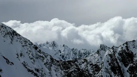 Winter mountains with dramatic cloudy sky panorama in day time Stock Footage 121576855