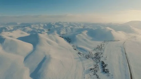 Winter in the mountains. Flying over the road in winter. Stock Footage 70396520