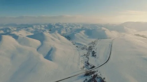 Winter in the mountains. Flying over the road in winter. Stock Footage 70397053