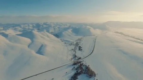 Winter in the mountains. Flying over the road in winter. Stock Footage 70398518