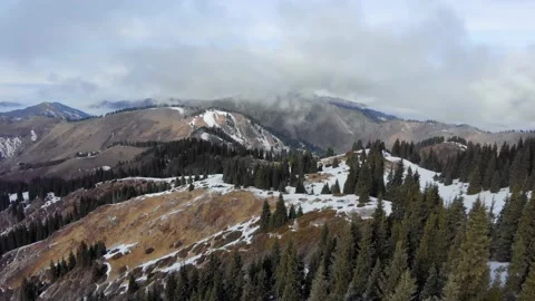 Winter in the mountains. The mountains cover the clouds Stock Footage 168902827