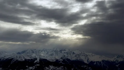 Winter mountains panorama with dramatic overcast sky during day time Stock Footage 121579203