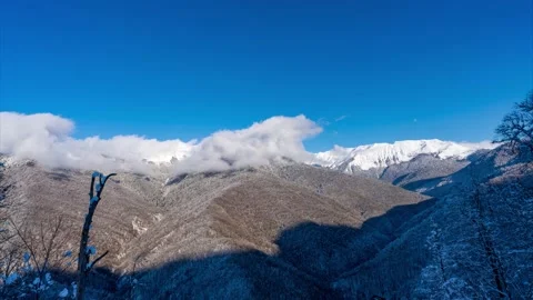 Winter in mountains with snow and clouds time lapse Stock Footage 146214569