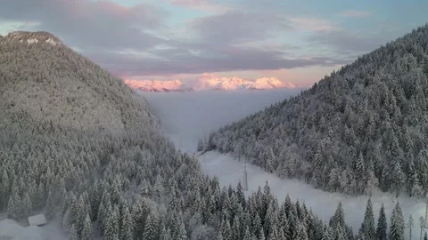 Winter mountains at sunrise over a ski resort Stock Footage 196142983