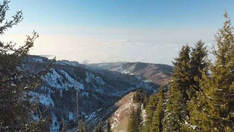 Winter mountains. Valley covered with clouds Stock Footage 103843665