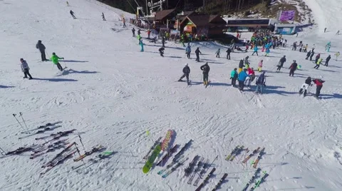 Winter mountains view. Riders on pistes of skiing resort, aerial view. Stock Footage