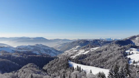 Winter in the mountains. Winter forest from a bird's eye view. Snow-covered Stock Footage 100408455