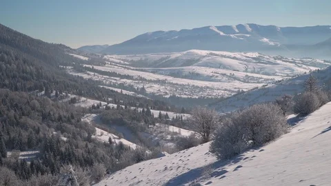 Winter in the mountains. Winter forest. Snow-covered trees in the mountains Stock Footage 100376751
