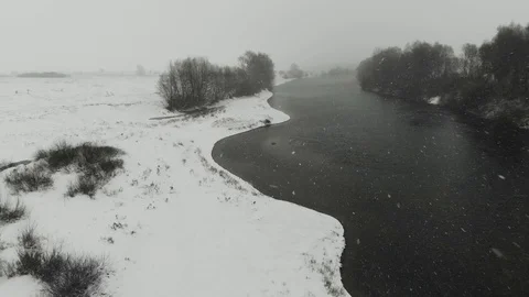 Winter nature with snowfall on a river Stock Footage 120304259