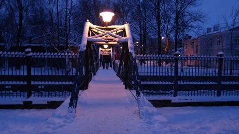 Winter night over the bridge into the distance are people. Stock Footage 70279050