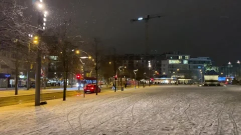 Winter night scenery with falling snow in Braunschweig city center panning Video stock 297411098