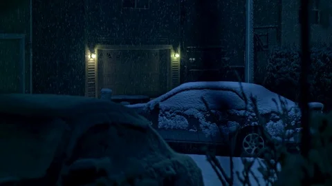 Winter night time snowfall in city during holiday season Stock Footage 81185684